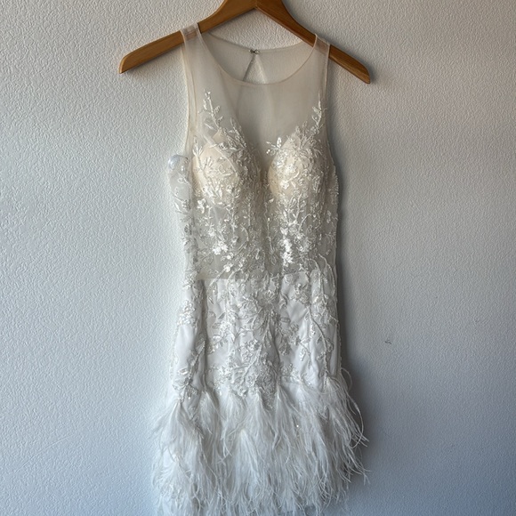 Jovani Scoop neck flower embellished bodice with mesh and a feathered Miniskirt. - Picture 5 of 10